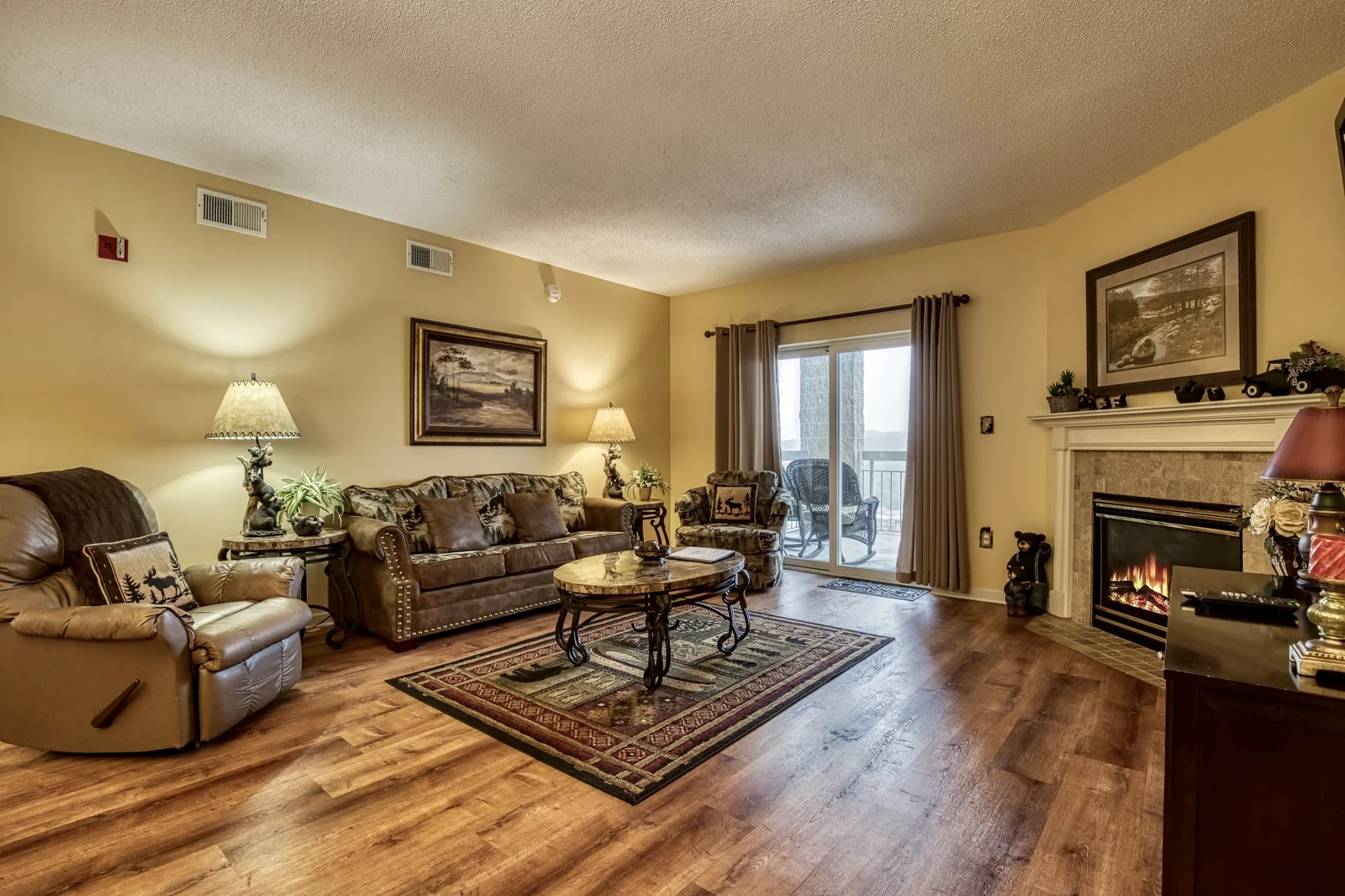 Spacious Whispering Pines living room with fireplace